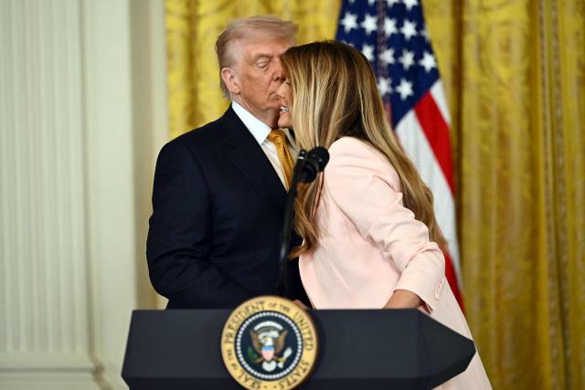 US President Donald Trump and First Lady Melania Trump participate in a Military Mother's Day Event in the East Room of the White House in Washington, DC, on May 6, 2026. (Photo by Kent NISHIMURA / AFP)