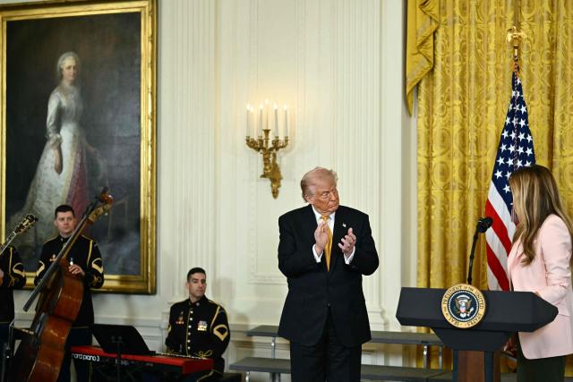 US President Donald Trump and First Lady Melania Trump participate in a Military Mother's Day Event in the East Room of the White House in Washington, DC, on May 6, 2026. (Photo by Kent NISHIMURA / AFP)