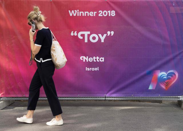 A fence around the fan zone of the 2026 Eurovision Song Contest, with a banner showing the name of the 2018 contest winner, Netta from Israel, is pictured outside the Wiener Stadthalle in Vienna, Austria on May 6, 2026. (Photo by Joe Klamar / AFP)