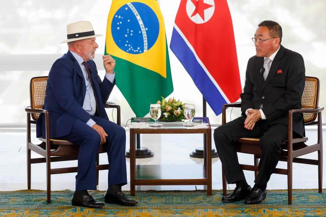Brazilian President Luiz Inacio Lula da Silva (L) with the Ambassador of the Democratic People's Republic of Korea, Song Se ll, during a ceremony for the presentation of credentials by new foreign ambassadors to Brazil, at the Planalto Palace, in Brasilia, on May 6, 2026. (Photo by Sergio Lima / AFP)