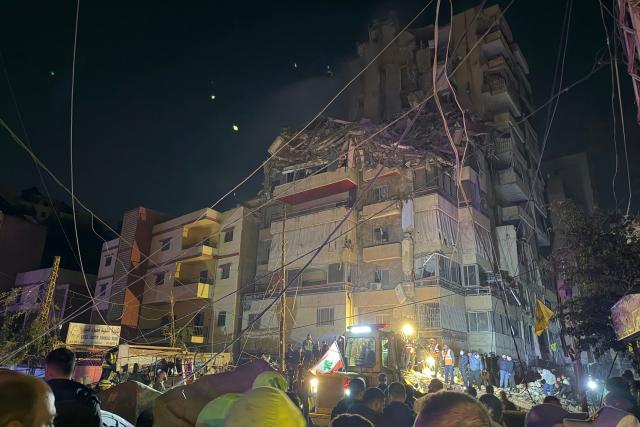 People gather at the site of an Israeli airstrike that targeted Beirut’s southern suburbs Haret Hreik neighborhood on May 6, 2026. An Israeli strike in Lebanon's eastern Bekaa valley killed four people on May 6, while the Israeli army said it struck Hezbollah targets in the south, after warning residents of a dozen towns to evacuate. Israel and Hezbollah have been trading accusations of violating the ceasefire agreement in force since April 17. (Photo by Ibrahim AMRO / AFP)