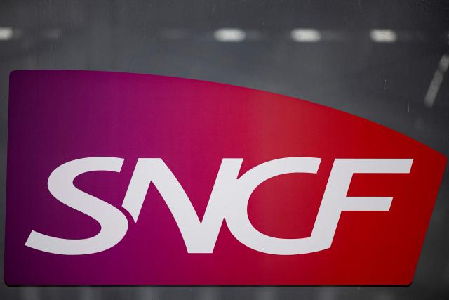 (FILES) This photograph shows the logo of French national railway company SNCF displayed on the entrance of Lille Europe train station in Lille, northern France on June 25, 2025. The four representative unions at SNCF announced on May 6, 2026 a joint call for a strike on June 10, to protest against the rail group’s "reorganizations," which are causing "human tragedies" among railway workers. (Photo by Sameer Al-DOUMY / AFP)