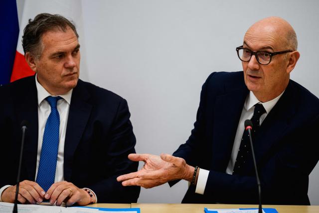 France's Transports Minister Philippe Tabarot (L) and France's Economy, Finances and Industry Minister Roland Lescure (R) hold a press conference after their meeting with representatives from the aviation industry to prepare for the summer season at the Transport Ministry in Paris on May 6, 2026. The meeting was called amid concerns over jet fuel supplies and costs following the closure of the Strait of Hormuz. (Photo by Dimitar DILKOFF / AFP)