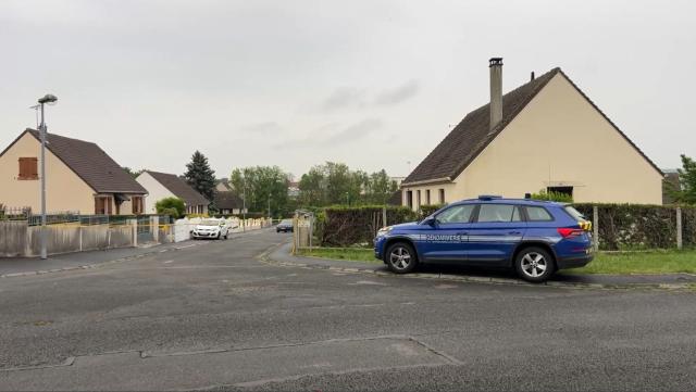 This screengrab made from an AFP video shows a gendarmerie car parked in a street in Fere-en-Tardenois, northern France where a 14-year-old middle school girl was killed. A 14-year-old middle school girl was killed on May 6, 2026 morning in a small town in the Aisne department, and the suspected murderer, a 23-year-old man who may be an ex-boyfriend, has been arrested, the public prosecutor’s office announced, adding that a murder investigation has been opened. (Photo by Noorullah SHIRZADA / AFP)