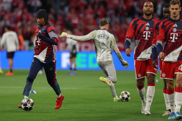 Bayern Munich's French midfielder #17 Michael Olise (L) and his teammates warms up prior to the UEFA Champions League second-leg, semi-final football match between FC Bayern Munich and Paris Saint-Germain (PSG) in Munich, southern Germany on May 6, 2026. (Photo by Odd ANDERSEN / AFP)