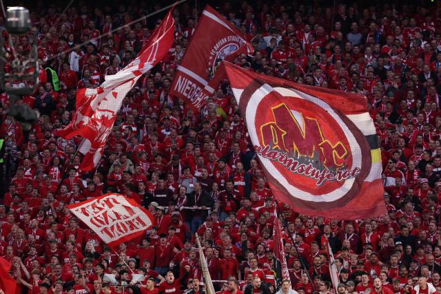 Bayern Munich fans cheer prior to the start of the UEFA Champions League second-leg, semi-final football match between FC Bayern Munich and Paris Saint-Germain (PSG) in Munich, southern Germany on May 6, 2026. (Photo by FRANCK FIFE / AFP)