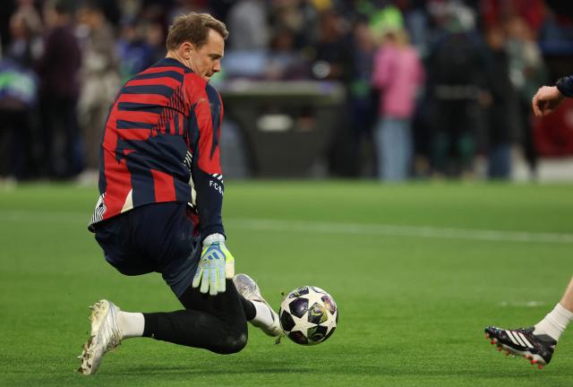 Bayern Munich's German goalkeeper #01 Manuel Neuer makes a bloch during warm up prior to the UEFA Champions League second-leg, semi-final football match between FC Bayern Munich and Paris Saint-Germain (PSG) in Munich, southern Germany on May 6, 2026. (Photo by Odd ANDERSEN / AFP)