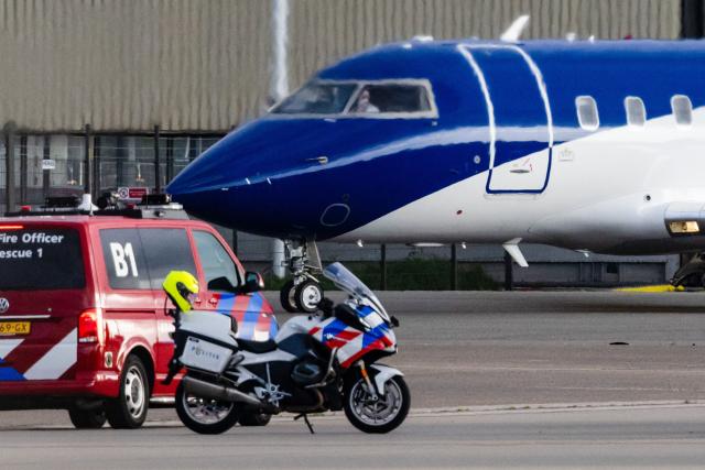 This photograph shows a Bombardier Challenger 605 medical aircraft allegedly carrying some of the passengers believed to be infected with hantavirus from the cruise ship MV Hondius at Schiphol Airport in Amsterdam on May 6, 2026. A plane that left Cape Verde following the evacuation of a cruise ship hit by the hantavirus landed in Spain's Canary Islands on May 6, while a second flight headed for the Netherlands. (Photo by Jeffrey Groeneweg / ANP / AFP) / Netherlands OUT