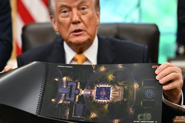 US President Donald Trump shows a rendering of the upcoming "UFC Freedom 250" event as he speaks in the Oval Office of the White House on May 6, 2026, in Washington, DC. An Ultimate Fighting Championship event will be staged on the White House's South Lawn in June. The June 14 event has been dubbed "UFC Freedom 250," in reference to the United States' 250th anniversary celebrations this summer. (Photo by Kent NISHIMURA / AFP)