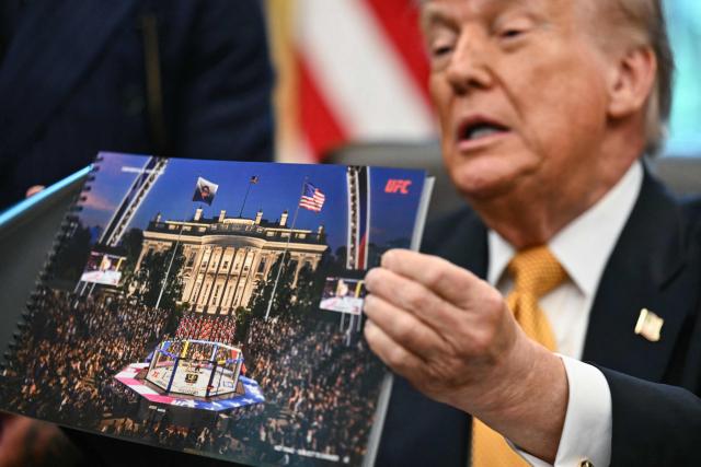 US President Donald Trump shows a rendering of the upcoming "UFC Freedom 250" event as he speaks in the Oval Office of the White House on May 6, 2026, in Washington, DC. An Ultimate Fighting Championship event will be staged on the White House's South Lawn in June. The June 14 event has been dubbed "UFC Freedom 250," in reference to the United States' 250th anniversary celebrations this summer. (Photo by Kent NISHIMURA / AFP)