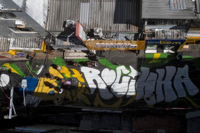 Aerial view of one of the main entrance streets to the Rocinha favela, decorated ahead of the 2026 FIFA World Cup, in Rio de Janeiro, Brazil, on May 6, 2026. (Photo by Pablo PORCIUNCULA / AFP)