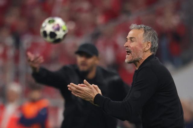 Paris Saint-Germain's Spanish head coach Luis Enrique (R) reacts during the UEFA Champions League second-leg, semi-final football match between FC Bayern Munich and Paris Saint-Germain (PSG) in Munich, southern Germany on May 6, 2026. (Photo by FRANCK FIFE / AFP)