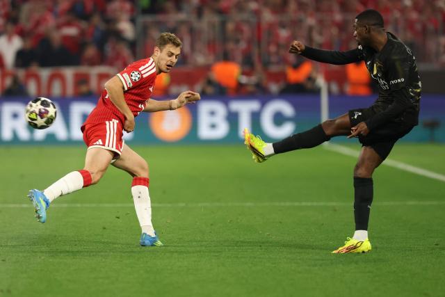 Paris Saint-Germain's French forward #10 Ousmane Dembele shoots past Bayern Munich's Crotian defender # 44 Josip Stanisic during the UEFA Champions League second-leg, semi-final football match between FC Bayern Munich and Paris Saint-Germain (PSG) in Munich, southern Germany on May 6, 2026. (Photo by Odd ANDERSEN / AFP)