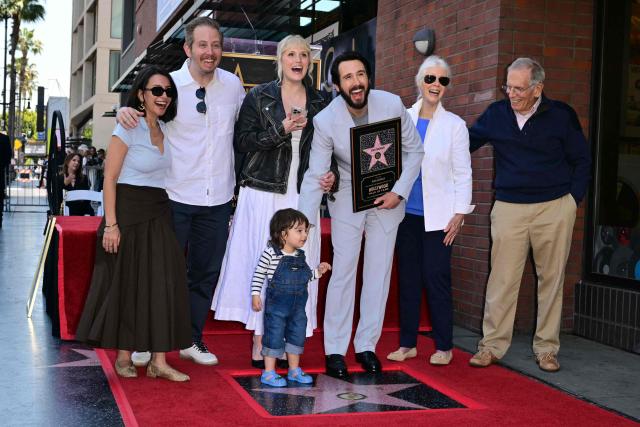 US singer-songwriter Josh Groban (C/R) poses with his fiance Natalie McQueen (C/L), his parents Jack (R) and Melinda Groban (2nd-R) and other relatives during his Walk of Fame unveiling star ceremony in Hollywood, California, on May 6, 2026. (Photo by Frederic J. Brown / AFP)