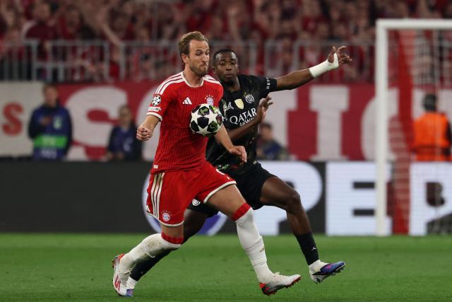 Bayern Munich's English forward #09 Harry Kane and Paris Saint-Germain's Ecuadoran defender #51 Willian Pacho (R) vie for the ball during the UEFA Champions League second-leg, semi-final football match between FC Bayern Munich and Paris Saint-Germain (PSG) in Munich, southern Germany on May 6, 2026. (Photo by FRANCK FIFE / AFP)