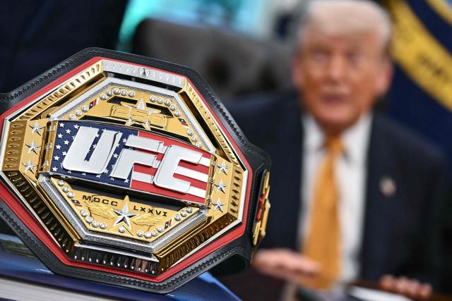 A UFC championship belt is displayed as US President Donald Trump speaks about the upcoming "UFC Freedom 250" event, in the Oval Office of the White House on May 6, 2026, in Washington, DC. An Ultimate Fighting Championship event will be staged on the White House's South Lawn in June. The June 14 event has been dubbed "UFC Freedom 250," in reference to the United States' 250th anniversary celebrations this summer. (Photo by Kent NISHIMURA / AFP)