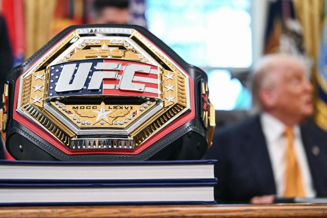 A UFC championship belt is displayed as US President Donald Trump speaks about the upcoming "UFC Freedom 250" event, in the Oval Office of the White House on May 6, 2026, in Washington, DC. An Ultimate Fighting Championship event will be staged on the White House's South Lawn in June. The June 14 event has been dubbed "UFC Freedom 250," in reference to the United States' 250th anniversary celebrations this summer. (Photo by Kent NISHIMURA / AFP)
