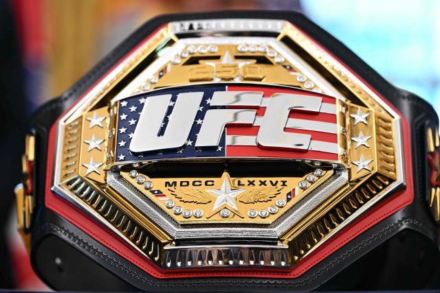 A UFC championship belt is displayed as US President Donald Trump speaks about the upcoming "UFC Freedom 250" event, in the Oval Office of the White House on May 6, 2026, in Washington, DC. An Ultimate Fighting Championship event will be staged on the White House's South Lawn in June. The June 14 event has been dubbed "UFC Freedom 250," in reference to the United States' 250th anniversary celebrations this summer. (Photo by Kent NISHIMURA / AFP)
