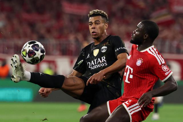 Paris Saint-Germain's French midfielder #14 Desire Doue (L) and Bayern Munich's French defender #02 Dayot Upamecano vie for the ball during the UEFA Champions League second-leg, semi-final football match between FC Bayern Munich and Paris Saint-Germain (PSG) in Munich, southern Germany on May 6, 2026. (Photo by FRANCK FIFE / AFP)