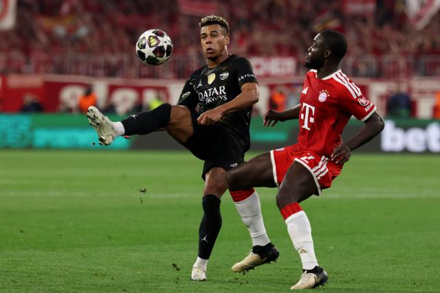 Paris Saint-Germain's French midfielder #14 Desire Doue (L) and Bayern Munich's French defender #02 Dayot Upamecano vie for the ball during the UEFA Champions League second-leg, semi-final football match between FC Bayern Munich and Paris Saint-Germain (PSG) in Munich, southern Germany on May 6, 2026. (Photo by FRANCK FIFE / AFP)