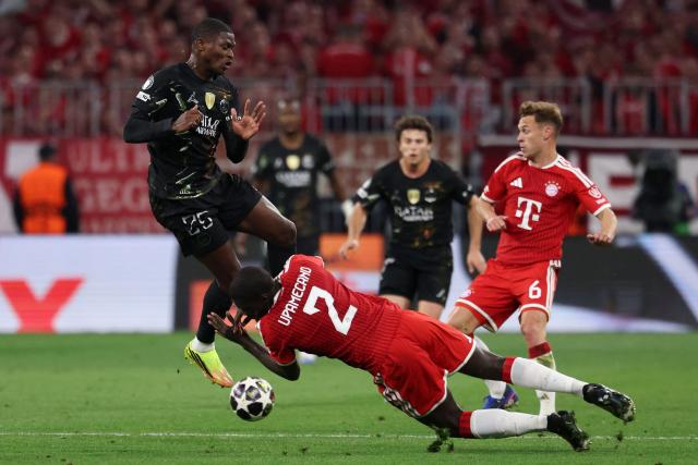 (From L) Paris Saint-Germain's Portuguese defender #25 Nuno Mendes, Bayern Munich's French defender #02 Dayot Upamecano and Bayern Munich's German midfielder #06 Joshua Kimmich vie for the ball during the UEFA Champions League second-leg, semi-final football match between FC Bayern Munich and Paris Saint-Germain (PSG) in Munich, southern Germany on May 6, 2026. (Photo by FRANCK FIFE / AFP)