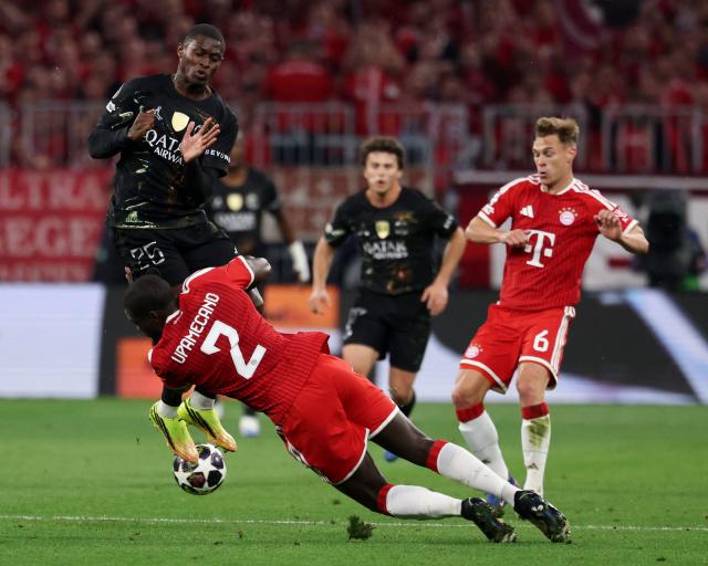 (From L) Paris Saint-Germain's Portuguese defender #25 Nuno Mendes, Bayern Munich's French defender #02 Dayot Upamecano and Bayern Munich's German midfielder #06 Joshua Kimmich vie for the ball during the UEFA Champions League second-leg, semi-final football match between FC Bayern Munich and Paris Saint-Germain (PSG) in Munich, southern Germany on May 6, 2026. (Photo by FRANCK FIFE / AFP)