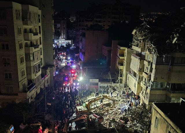 First responders gather at the site of an Israeli airstrike in Beirut’s southern suburb of Haret Hreik neighborhood on May 6, 2026. An Israeli strike in Lebanon's eastern Bekaa valley killed four people on May 6, while the Israeli army said it struck Hezbollah targets in the south, after warning residents of a dozen towns to evacuate. Israel and Hezbollah have been trading accusations of violating the ceasefire agreement in force since April 17. (Photo by AFP)