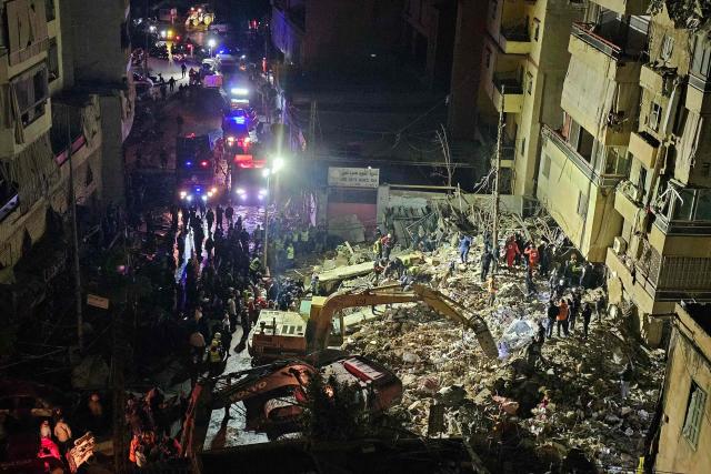First responders gather at the site of an Israeli airstrike in Beirut’s southern suburb of Haret Hreik neighborhood on May 6, 2026. An Israeli strike in Lebanon's eastern Bekaa valley killed four people on May 6, while the Israeli army said it struck Hezbollah targets in the south, after warning residents of a dozen towns to evacuate. Israel and Hezbollah have been trading accusations of violating the ceasefire agreement in force since April 17. (Photo by AFP)