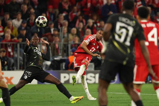 Bayern Munich's French midfielder #17 Michael Olise shoots past Paris Saint-Germain's Portuguese defender #25 Nuno Mendes (L) during the UEFA Champions League second-leg, semi-final football match between FC Bayern Munich and Paris Saint-Germain (PSG) in Munich, southern Germany on May 6, 2026. (Photo by Odd ANDERSEN / AFP)