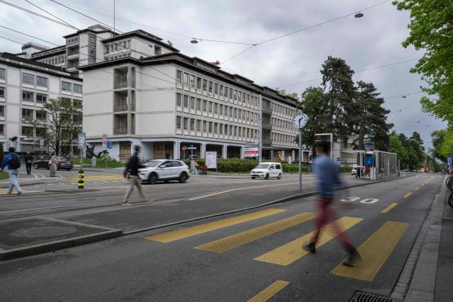 Pedestrians walk next to the University Hospital Zurich (USZ) where a former passenger of a cruise ship stricken by a deadly hantavirus outbreak is being treated, in Zurich on May 6, 2026. The Dutch-flagged cruise ship MV Hondius has been at the centre of an international health scare since last weekend, when the UN's health agency was informed that three passengers had died and the suspected cause was hantavirus. The rare disease is usually spread from infected rodents, typically through urine, droppings and saliva. (Photo by ENNIO LEANZA / AFP)