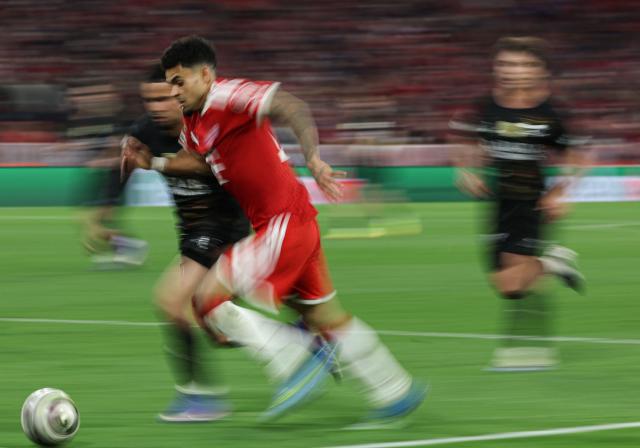 Bayern Munich's Colombian forward Luis Diaz (Front) runs with the ball during the UEFA Champions League second-leg, semi-final football match between FC Bayern Munich and Paris Saint-Germain (PSG) in Munich, southern Germany on May 6, 2026. (Photo by FRANCK FIFE / AFP)