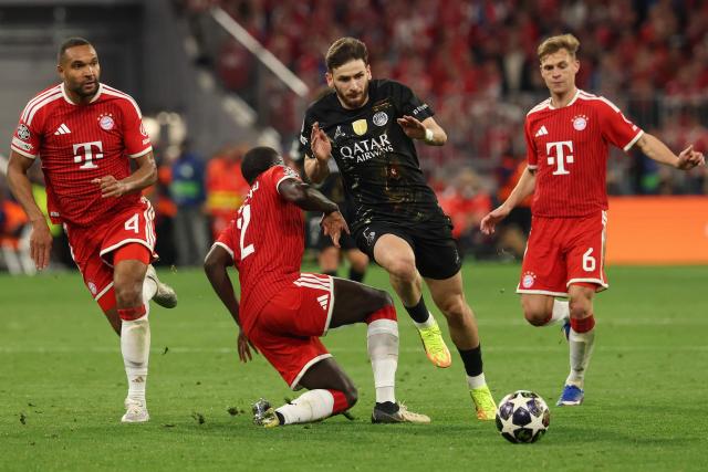 Paris Saint-Germain's Georgian forward #07 Khvicha Kvaratskhelia attempts to get past Bayern Munich's French defender #02 Dayot Upamecano during the UEFA Champions League second-leg, semi-final football match between FC Bayern Munich and Paris Saint-Germain (PSG) in Munich, southern Germany on May 6, 2026. (Photo by Odd ANDERSEN / AFP)
