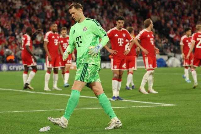Bayern Munich's German goalkeeper #01 Manuel Neuer kicks a watr bottle off the pitch during the UEFA Champions League second-leg, semi-final football match between FC Bayern Munich and Paris Saint-Germain (PSG) in Munich, southern Germany on May 6, 2026. (Photo by Odd ANDERSEN / AFP)