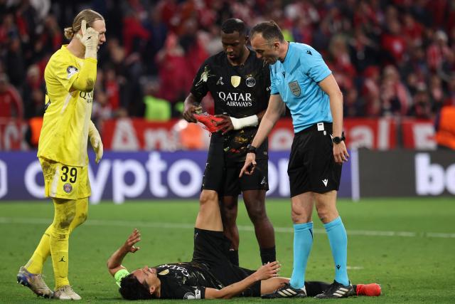 Paris Saint-Germain's Brazilian defender #05 Marquinhos reacts injured on the pitch during the UEFA Champions League second-leg, semi-final football match between FC Bayern Munich and Paris Saint-Germain (PSG) in Munich, southern Germany on May 6, 2026. (Photo by FRANCK FIFE / AFP)