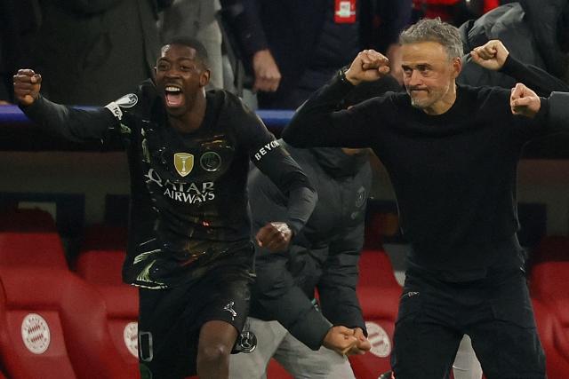 Paris Saint-Germain's Spanish head coach Luis Enrique (R) and his players including Paris Saint-Germain's French forward #10 Ousmane Dembele (L) celebtrate after the UEFA Champions League second-leg, semi-final football match between FC Bayern Munich and Paris Saint-Germain (PSG) in Munich, southern Germany on May 6, 2026. the UEFA Champions League second-leg, semi-final football match between FC Bayern Munich and Paris Saint-Germain (PSG) in Munich, southern Germany on May 6, 2026. (Photo by Odd ANDERSEN / AFP)