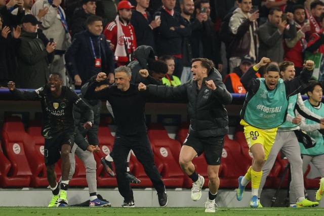 Paris Saint-Germain's Spanish head coach Luis Enrique and his players including Paris Saint-Germain's French forward #10 Ousmane Dembele (L) celebtrate after the UEFA Champions League second-leg, semi-final football match between FC Bayern Munich and Paris Saint-Germain (PSG) in Munich, southern Germany on May 6, 2026. the UEFA Champions League second-leg, semi-final football match between FC Bayern Munich and Paris Saint-Germain (PSG) in Munich, southern Germany on May 6, 2026. (Photo by Odd ANDERSEN / AFP)
