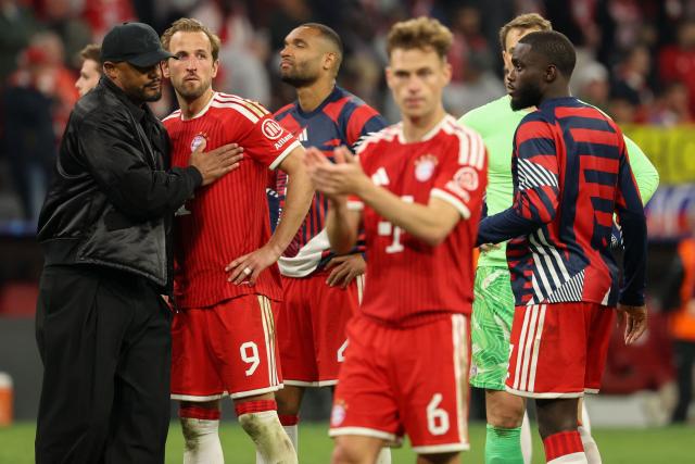 Bayern Munich's Belgian head coach Vincent Kompany (L) greets his players including Bayern Munich's English forward #09 Harry Kane after the UEFA Champions League second-leg, semi-final football match between FC Bayern Munich and Paris Saint-Germain (PSG) in Munich, southern Germany on May 6, 2026. (Photo by Odd ANDERSEN / AFP)