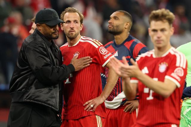 Bayern Munich's Belgian head coach Vincent Kompany (L) greets his players including Bayern Munich's English forward #09 Harry Kane after the UEFA Champions League second-leg, semi-final football match between FC Bayern Munich and Paris Saint-Germain (PSG) in Munich, southern Germany on May 6, 2026. (Photo by Odd ANDERSEN / AFP)