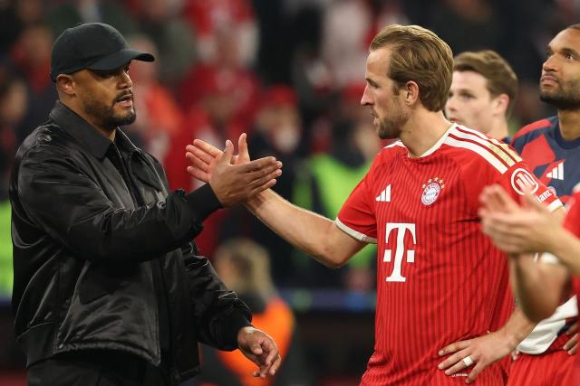 Bayern Munich's Belgian head coach Vincent Kompany (L) shake hands with his players including Bayern Munich's English forward #09 Harry Kane after the UEFA Champions League second-leg, semi-final football match between FC Bayern Munich and Paris Saint-Germain (PSG) in Munich, southern Germany on May 6, 2026. (Photo by Odd ANDERSEN / AFP)