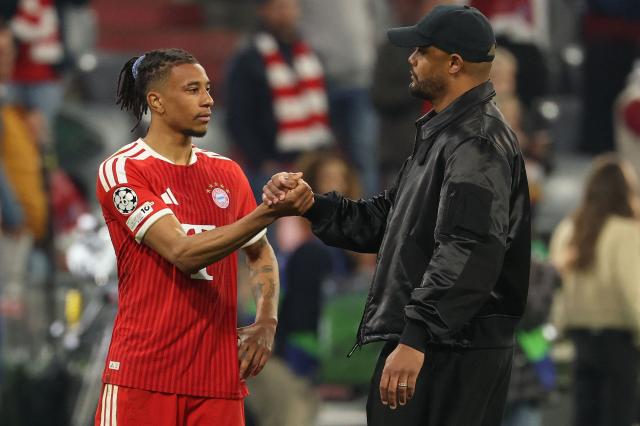 Bayern Munich's French midfielder #17 Michael Olise and Bayern Munich's Belgian head coach Vincent Kompany shake hands after the UEFA Champions League second-leg, semi-final football match between FC Bayern Munich and Paris Saint-Germain (PSG) in Munich, southern Germany on May 6, 2026. (Photo by Odd ANDERSEN / AFP)