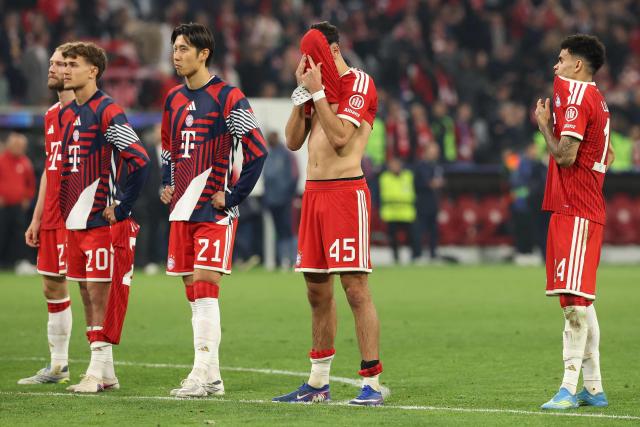 (From L) Bayern Munich's Austrian midfielder #27 Konrad Laimer, Bayern Munich's German midfielder #20 Tom Bischof, Bayern Munich's Japanese defender #21 Hiroki Ito and Bayern Munich's Colombian forward Luis Diaz react the UEFA Champions League second-leg, semi-final football match between FC Bayern Munich and Paris Saint-Germain (PSG) in Munich, southern Germany on May 6, 2026. (Photo by Odd ANDERSEN / AFP)