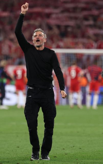 Paris Saint-Germain's Spanish head coach Luis Enrique celebrates after the UEFA Champions League second-leg, semi-final football match between FC Bayern Munich and Paris Saint-Germain (PSG) in Munich, southern Germany on May 6, 2026. (Photo by FRANCK FIFE / AFP)