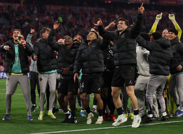 Paris Saint-Germain's players celebrate after the UEFA Champions League second-leg, semi-final football match between FC Bayern Munich and Paris Saint-Germain (PSG) in Munich, southern Germany on May 6, 2026. (Photo by FRANCK FIFE / AFP)