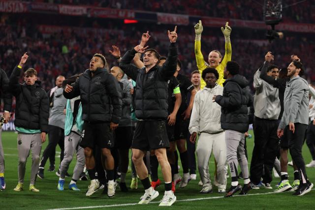 Paris Saint-Germain's players celebrate after the UEFA Champions League second-leg, semi-final football match between FC Bayern Munich and Paris Saint-Germain (PSG) in Munich, southern Germany on May 6, 2026. (Photo by FRANCK FIFE / AFP)