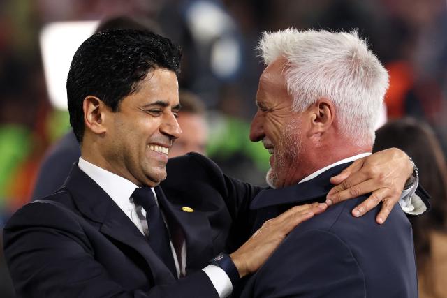 Paris Saint Germain's Qatari President Nasser al-Khelaifi (L) celebrates the team's win with French former footballer David Ginola after the UEFA Champions League second-leg, semi-final football match between FC Bayern Munich and Paris Saint-Germain (PSG) in Munich, southern Germany on May 6, 2026. (Photo by FRANCK FIFE / AFP)