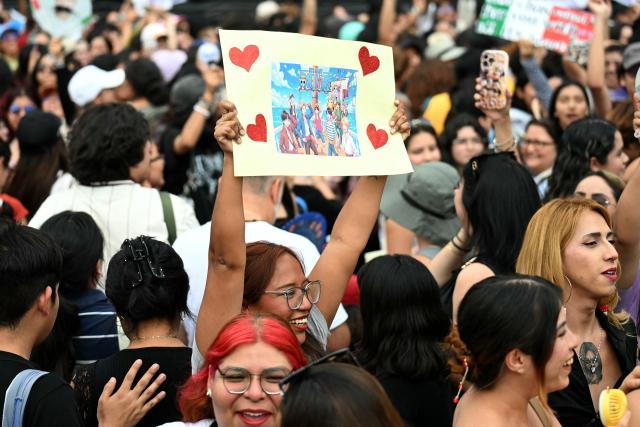 Fans of South Korean K-pop band BTS wait outside the National Palace where band members are expected to appear on the balcony at Zocalo square in Mexico City on May 6, 2026. BTS will hold three sold-out shows at Estadio GNP Seguros in Mexico city on May 7, 9, and 10. (Photo by YURI CORTEZ / AFP)