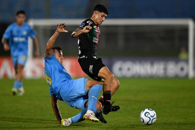 Montevideo City Torque's Argentine midfielder #14 Bautista Kociubinski and Palestino's midfielder #15 Francisco Montes fight for the ball during the Copa Sudamericana group stage football match between Uruguay's Montevideo City Torque and Chile's Palestino at the Centenario stadium in Montevideo on May 6, 2026. (Photo by Eitan ABRAMOVICH / AFP)
