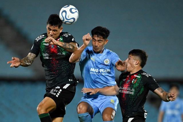 Montevideo City Torque's forward #09 Salomon Rodriguez (C) fight for the ball with Palestino's defender #03 Enzo Roco (L) and defender #02 Vicente Espinoza during the Copa Sudamericana group stage football match between Uruguay's Montevideo City Torque and Chile's Palestino at the Centenario stadium in Montevideo on May 6, 2026. (Photo by Eitan ABRAMOVICH / AFP)