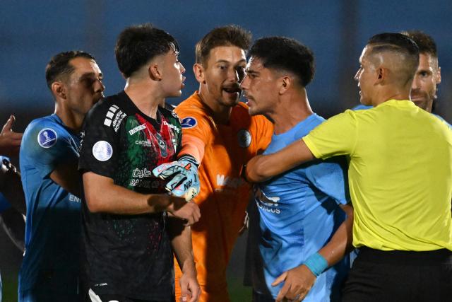 Palestino's defender #29 Ian Garguez (L) and Montevideo City Torque's forward #09 Salomon Rodriguez (R) confront each other during the Copa Sudamericana group stage football match between Uruguay's Montevideo City Torque and Chile's Palestino at the Centenario stadium in Montevideo on May 6, 2026. (Photo by Eitan ABRAMOVICH / AFP)