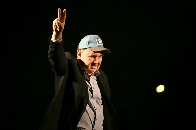 Peru's presidential candidate for the Renovacion Popular party, Rafael Lopez Aliaga, gestures to supporters during a rally to demand respect for the recent elections in Lima on May 6, 2026. (Photo by ERNESTO BENAVIDES / AFP)